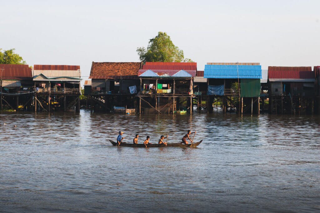Children Paddling through Kampong Khleang